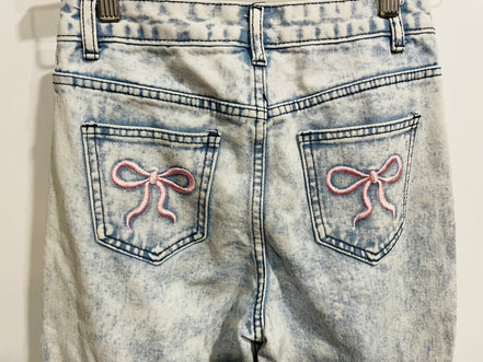 Washed-out jeans & 11 years old buckles