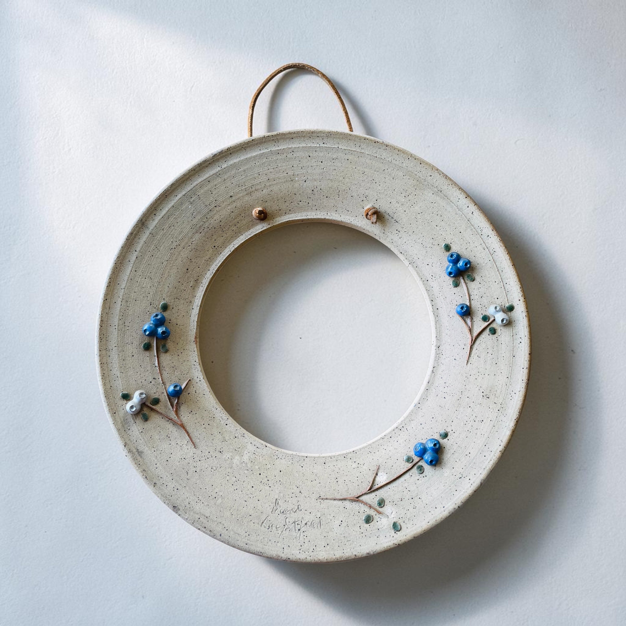Cadre rond Grès et bleuets