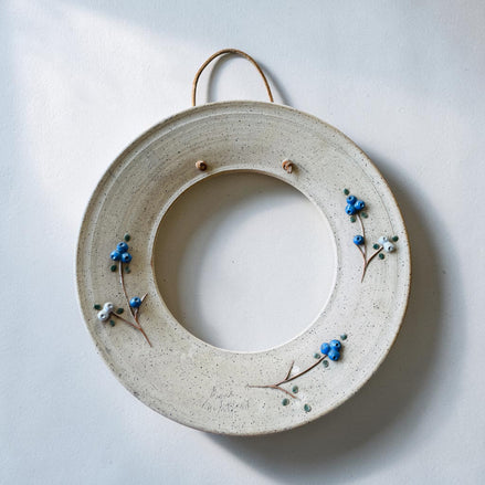 Cadre rond Grès et bleuets